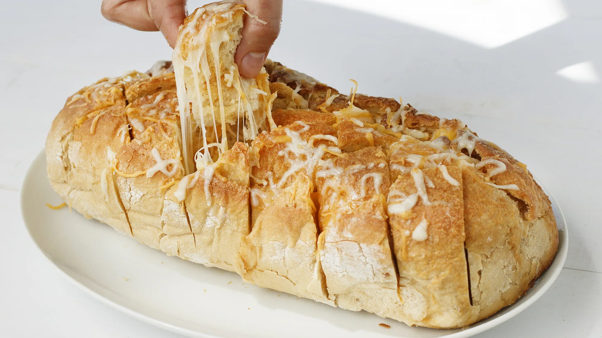 MCK-WebsiteImages-CheesyGarlicPotatoes-Desktop-2000x1125